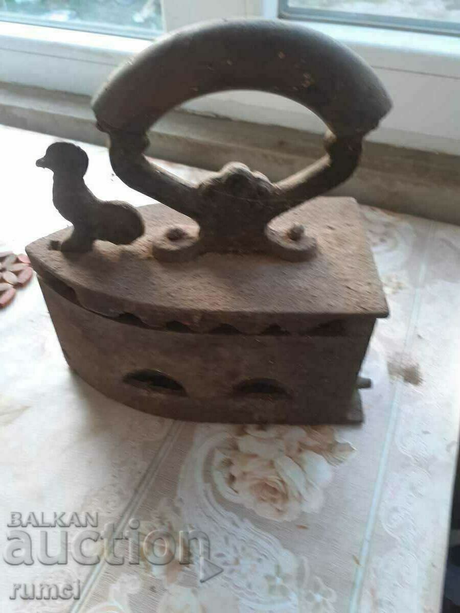 Auction  An old iron on fire