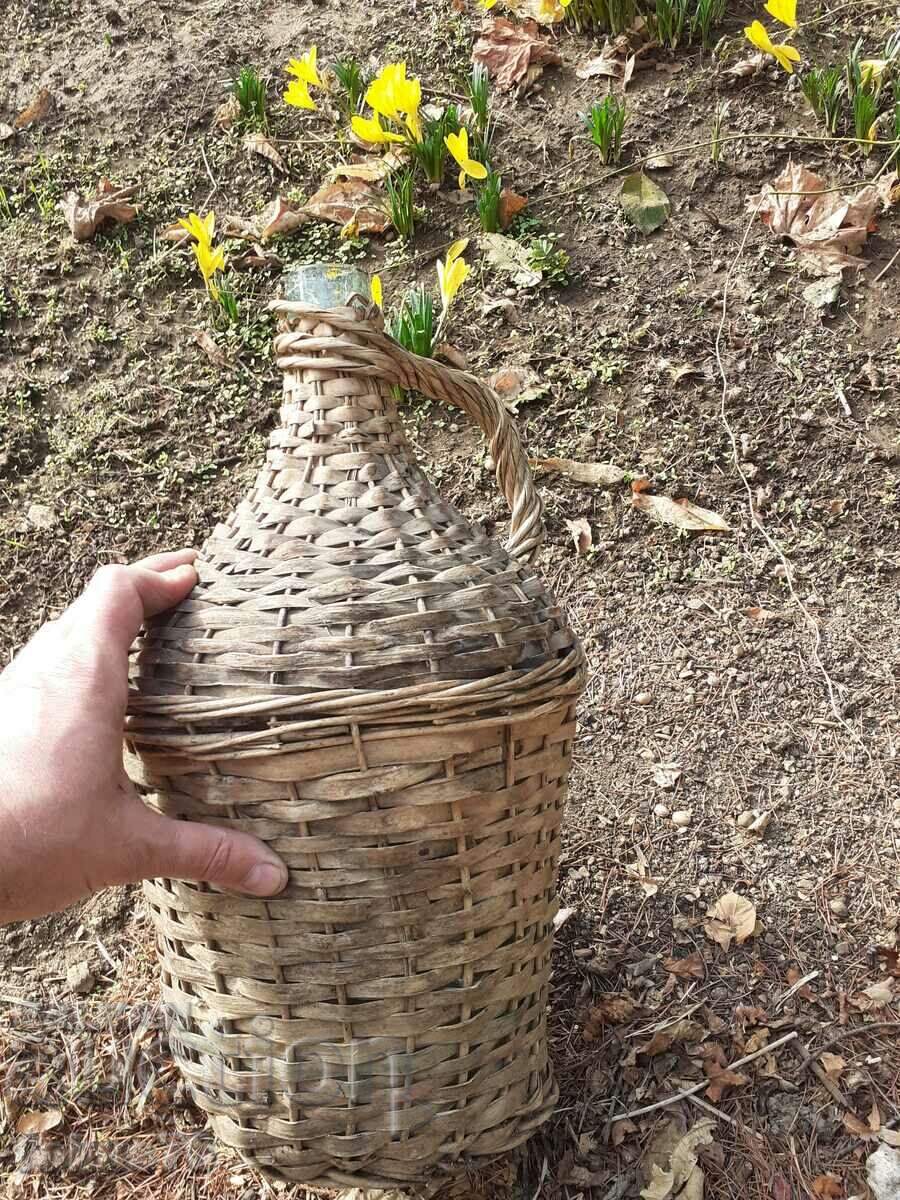 Delivery of Old glass damajana entwined with rattan Delivery of Old glass damajana entwined with rattan