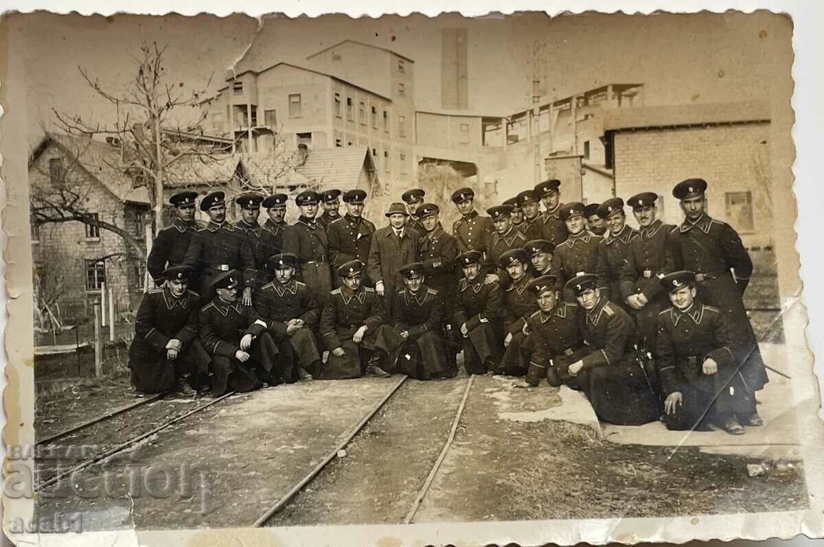 Officers outside a factory