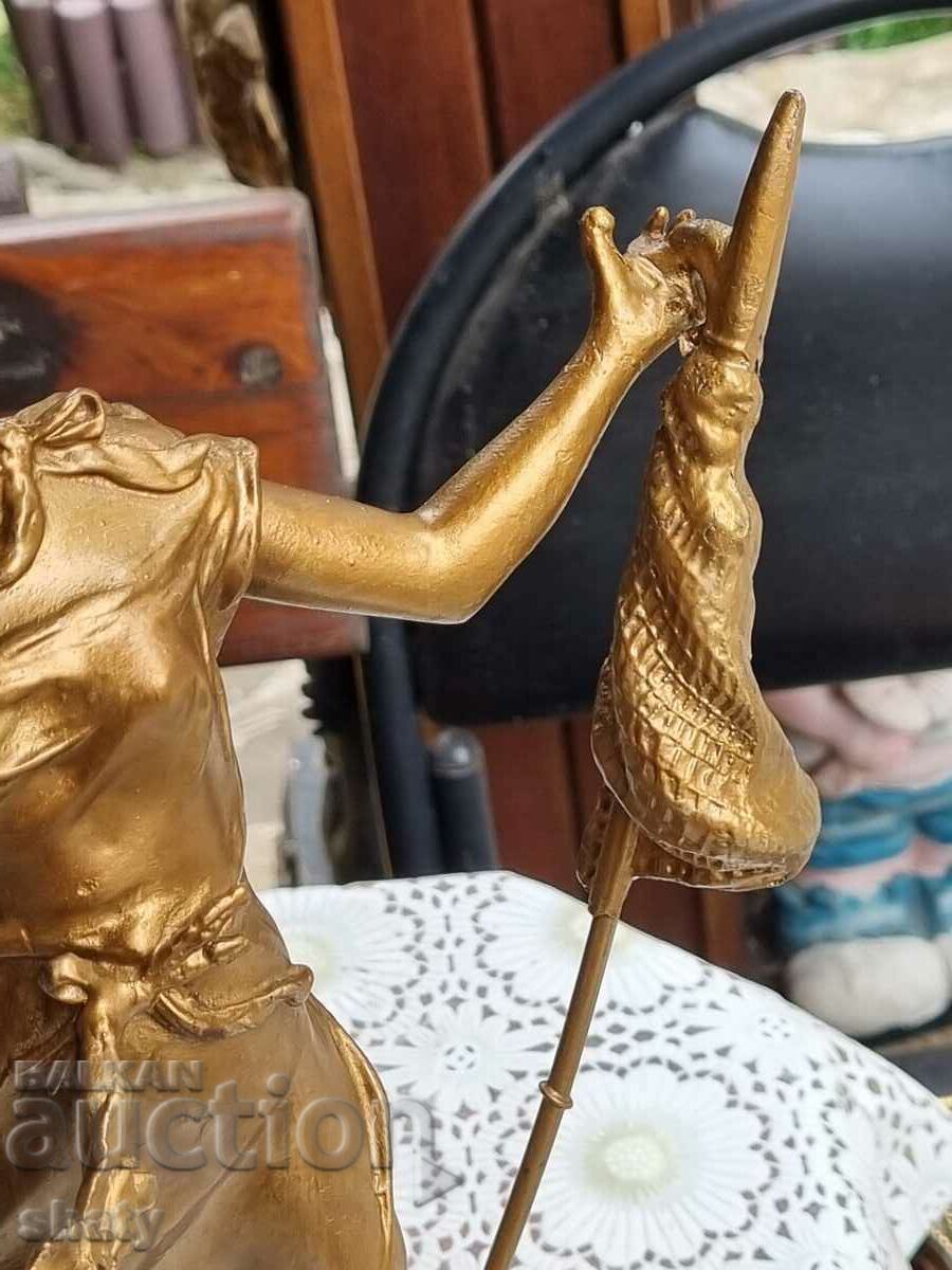 Auction  Old sculpture. Metal figure