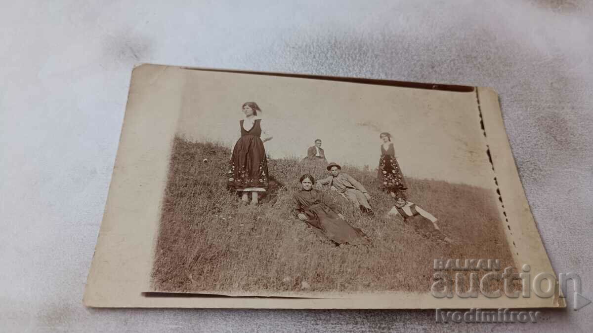 Photo Two young men and women on the meadow 1925