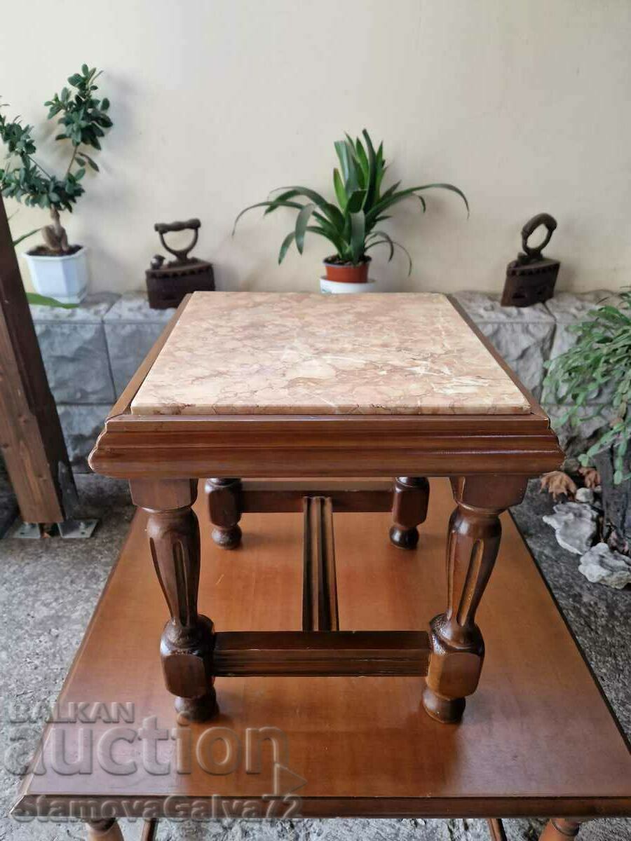 A lovely antique solid wood coffee table with a marble top