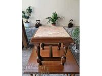 A lovely antique solid wood coffee table with a marble top