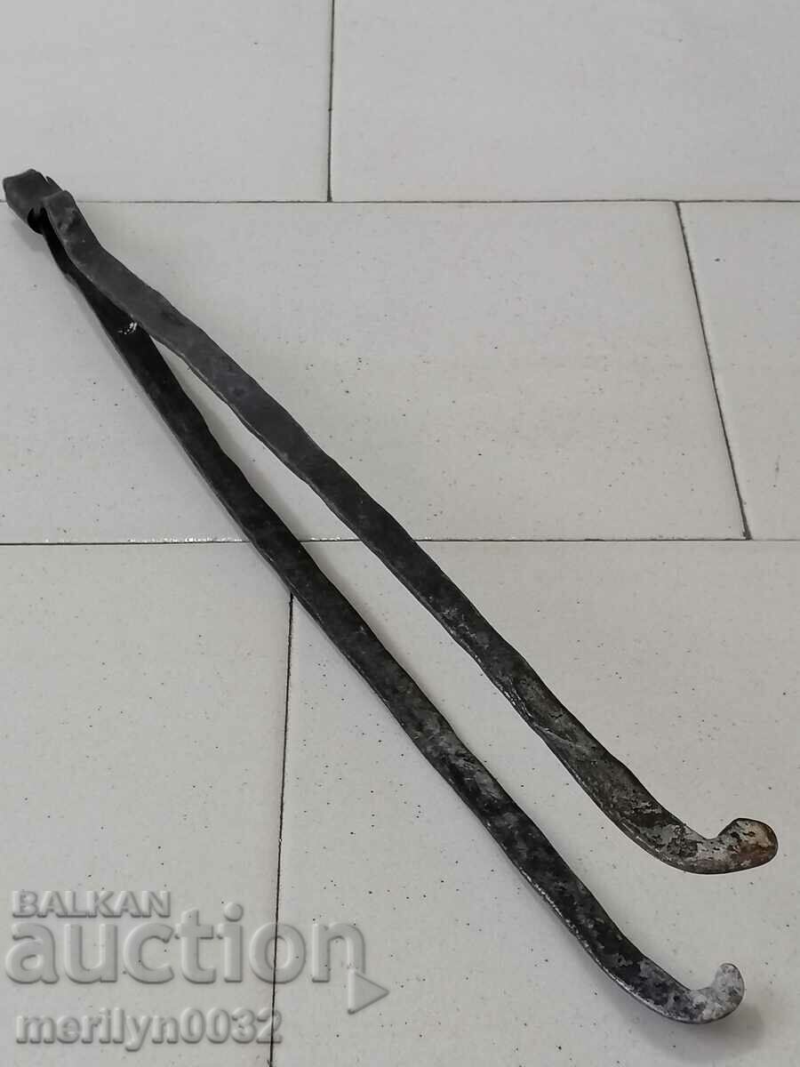 Old hand-forged dilaf, wrought iron, tongs