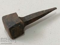 A primitive anvil for pinning hair