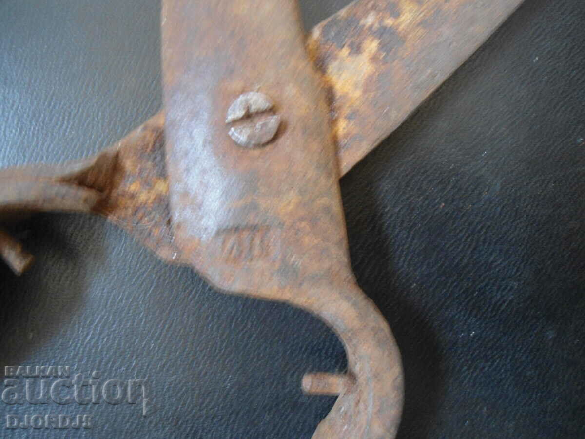 Delivery of Old forged scissors, marking