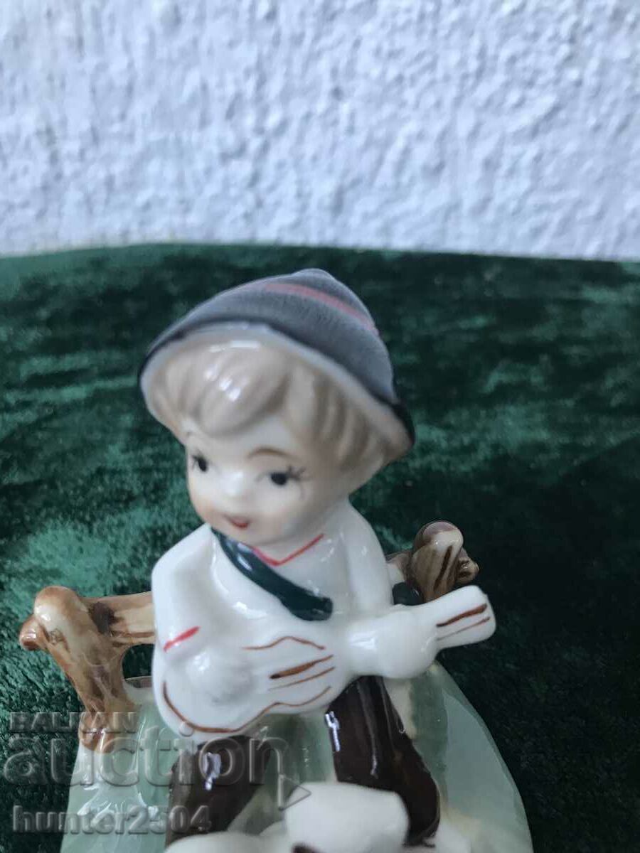 Auction Boy with a squirrel - 8.5 cm Auction Boy with a squirrel - 8.5 cm