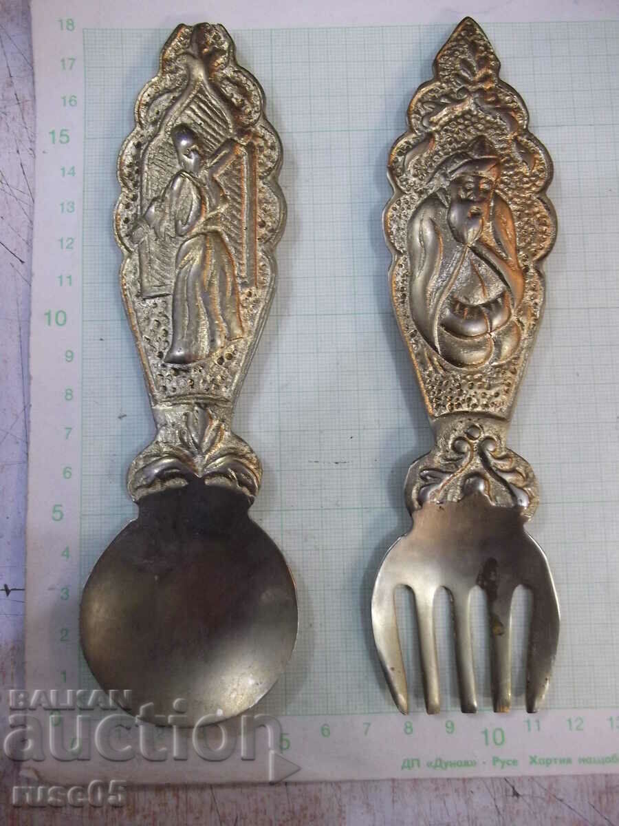 Set of bronze spoon and fork with embossed figures