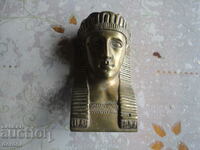 Ancient bronze sculpture of a pharaoh
