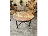 A great antique solid wood coffee table with a marble top