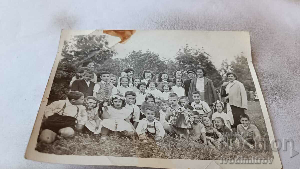 Photo Pupils with their teachers on the meadow