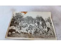 Photo Pupils with their teachers on the meadow