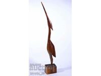 large wooden figure of a bird, handmade