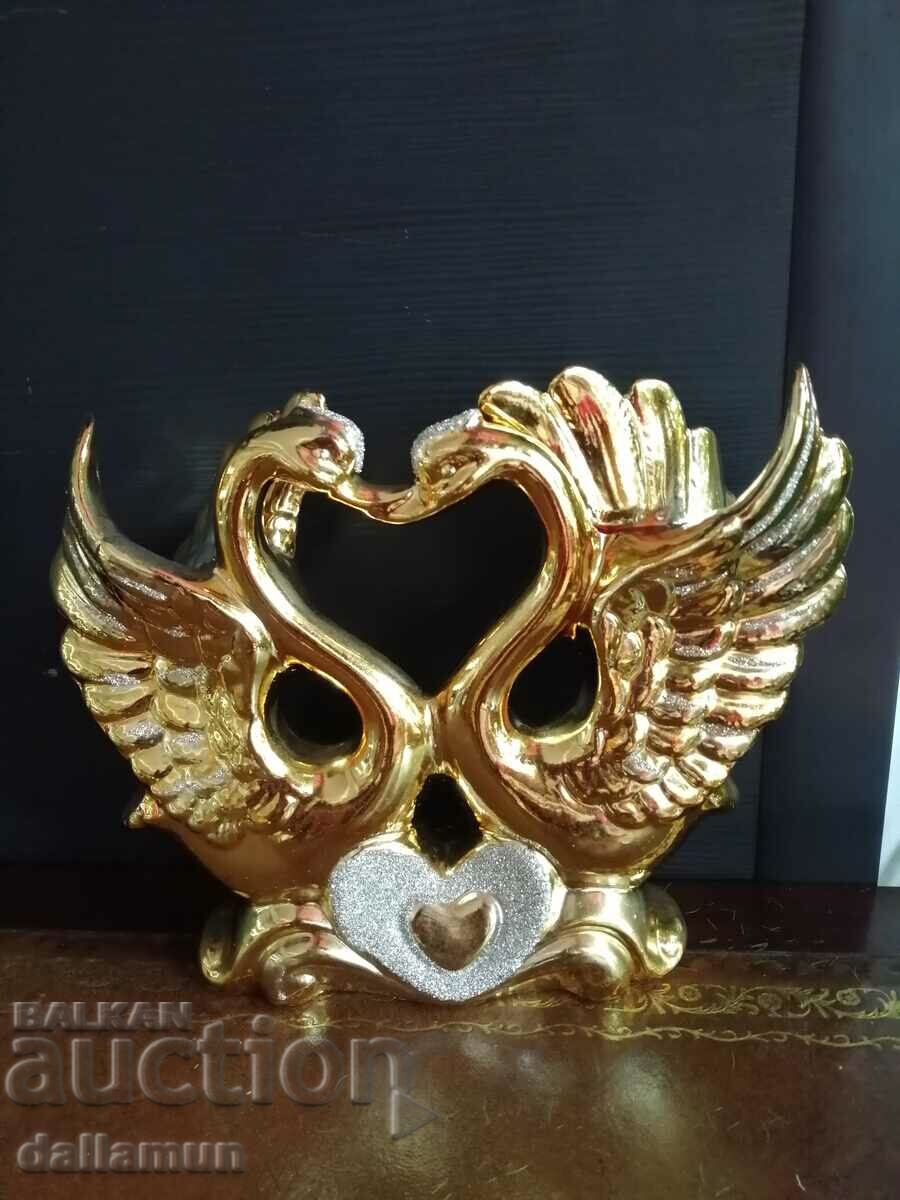 a golden statuette of a pair of swans with price 30.00 BGN | € 15.34
