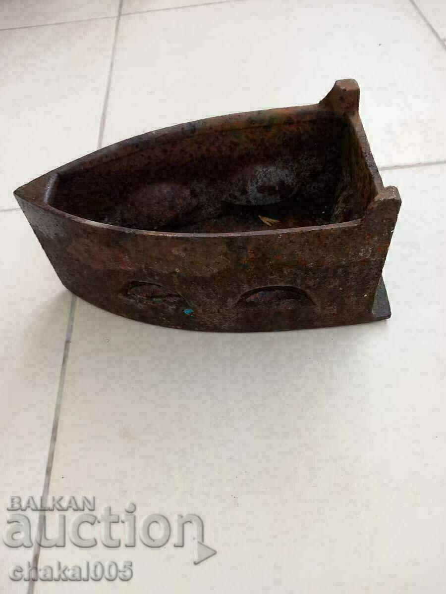 Auction  An old iron on fire