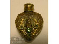 Antique perfume bottle with openwork decoration