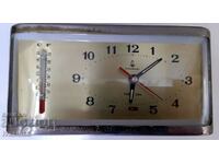Old mechanical Chinese alarm clock with thermometer