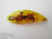 Old lady's brooch with embedded amber pieces