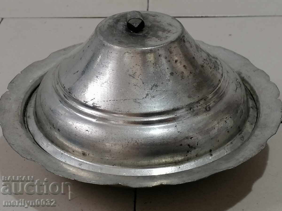 A copper renaissance saucer with a lid