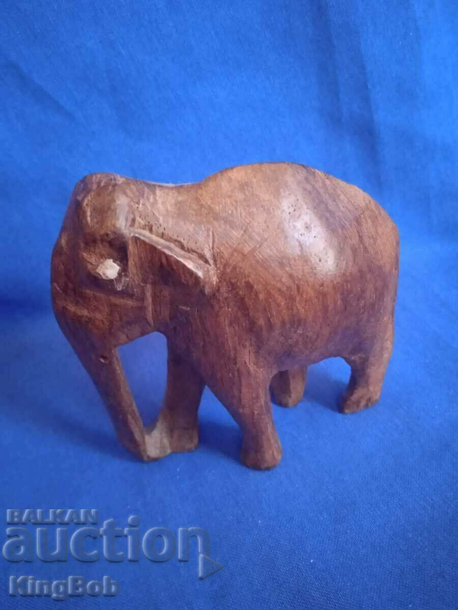 Auction WOODEN FIGURINE OF AN ELEPHANT Auction WOODEN FIGURINE OF AN ELEPHANT