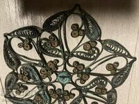 Old beautiful filigree coaster for hot dishes