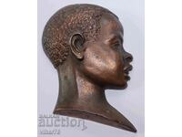 Old bronze wall figure