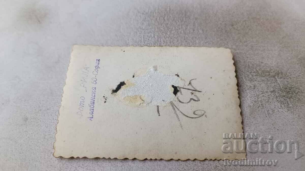 Photo Sofia A man with a suitcase and a boy in front of the Courthouse with price 2.35 BGN | € 1.20