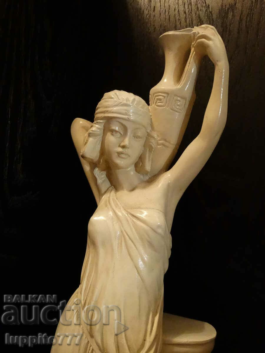 Auction Sculpture statuette of an antique female figure with a jar Auction Sculpture statuette of an antique female figure with a jar