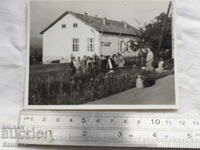 Photo in front of the building of BTS Uzana hut Boriki K401