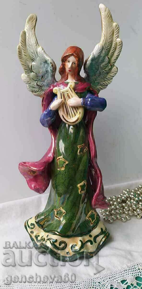 Auction Statuette of a huge porcelain angel Auction Statuette of a huge porcelain angel