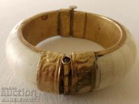 old ethnic style bracelet made of bone and brass