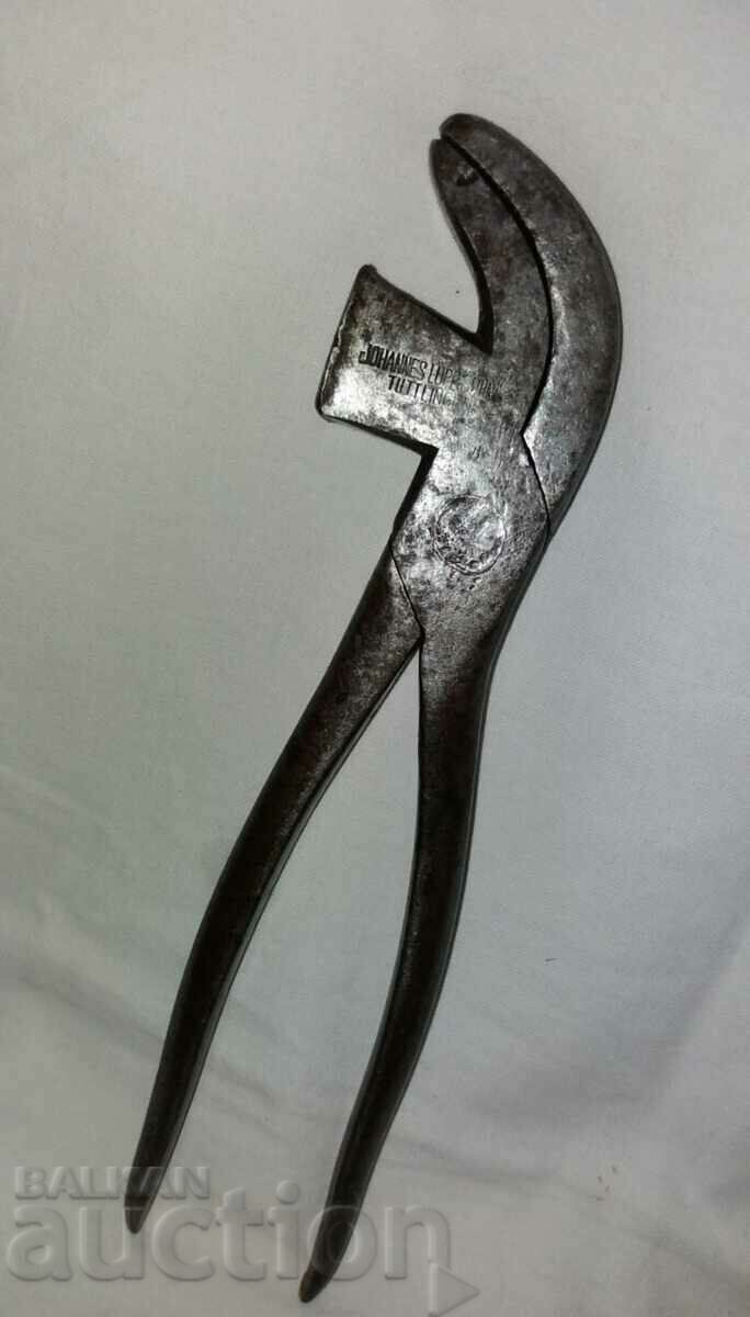 An old branded craft cobbler's tool