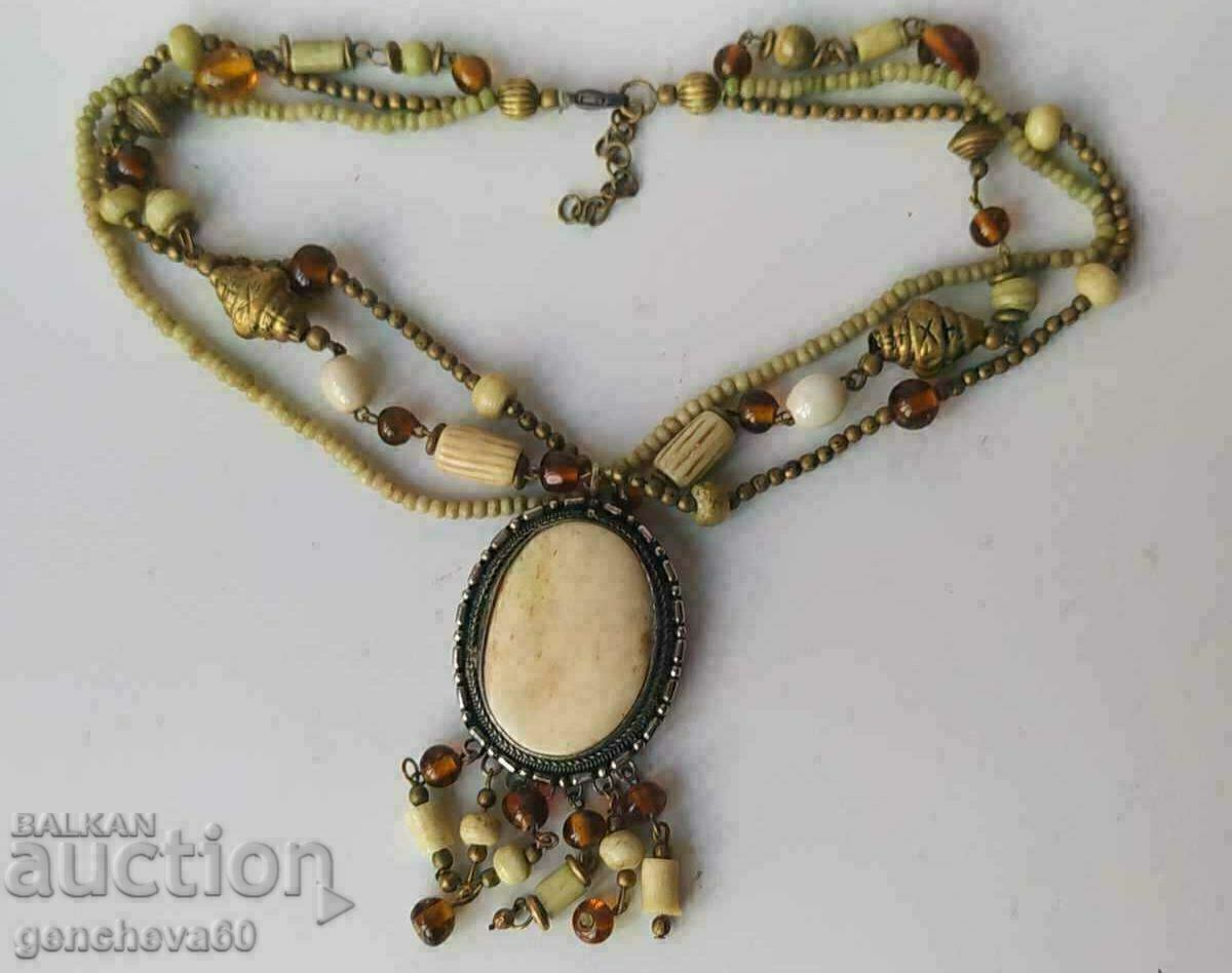 Ancient ethnic necklace, bone, bronze, stones, beads