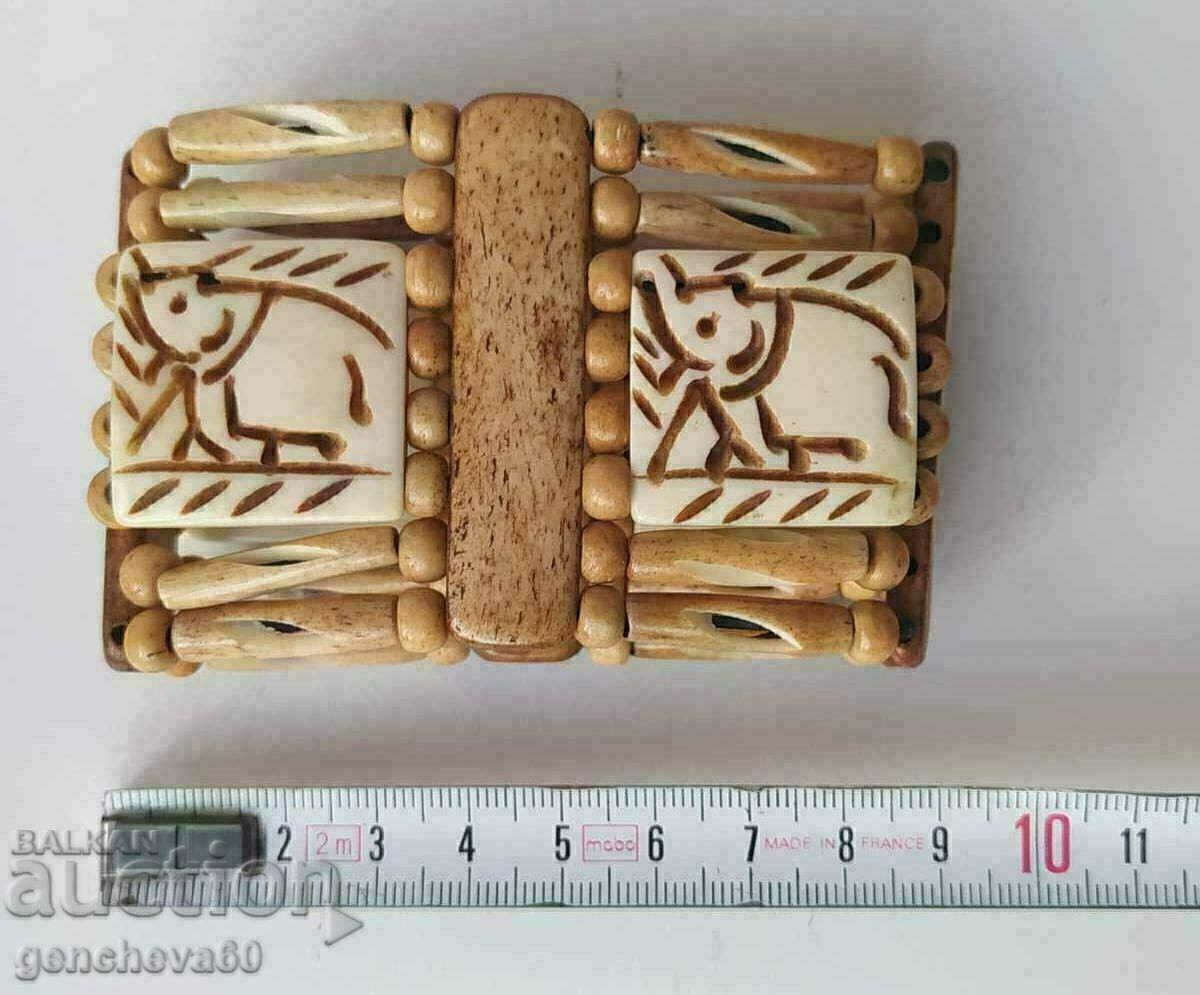 Auction  Wide bone bracelet with elephant carving