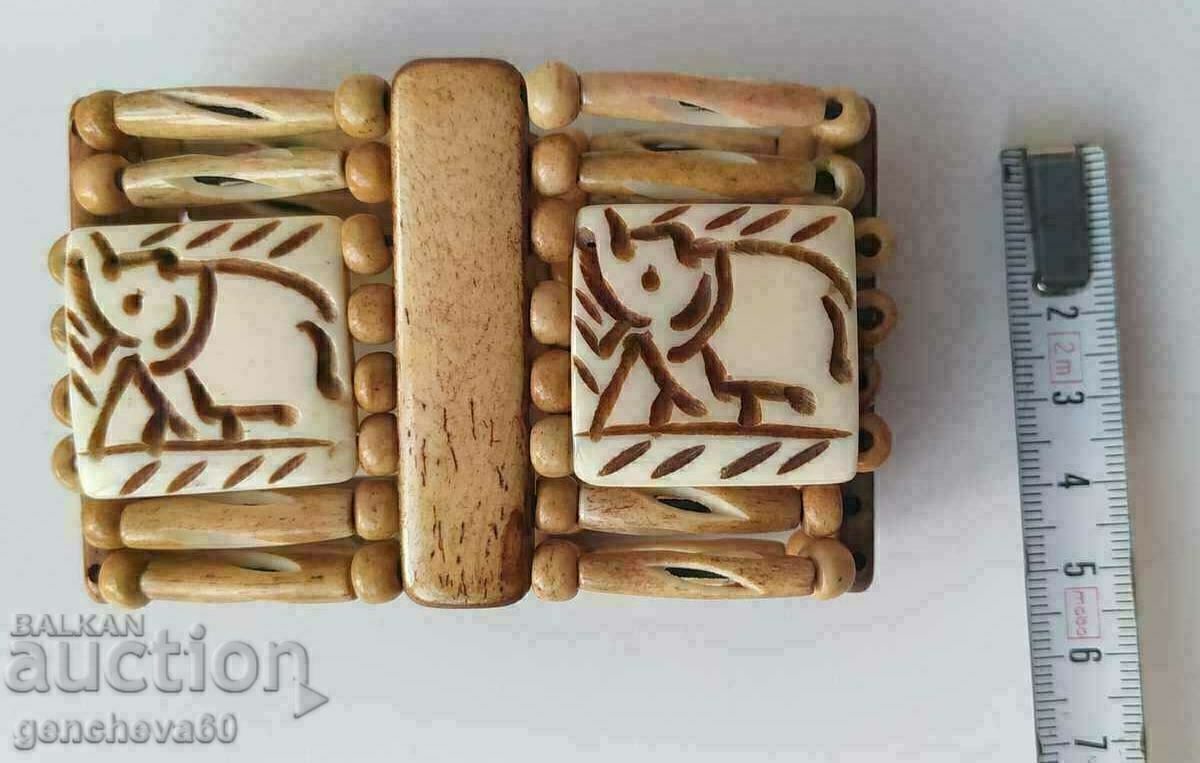 Delivery of Wide bone bracelet with elephant carving