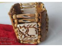 Wide bone bracelet with elephant carving