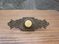 antique bronze bell with ornaments and bone button