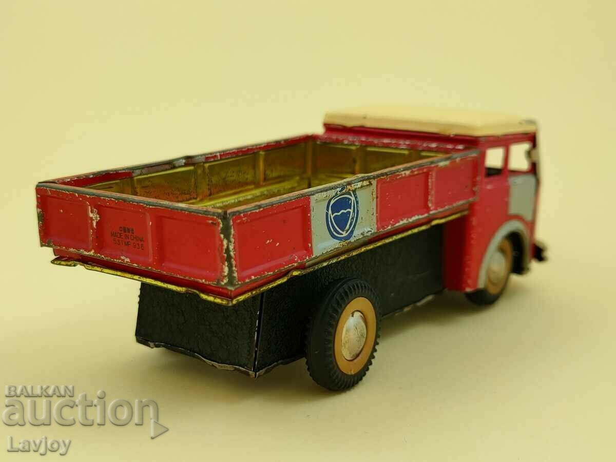 Delivery of Old metal toy truck