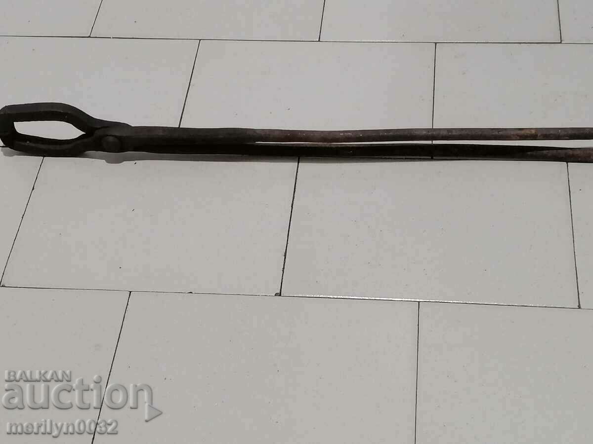Delivery of Old blacksmith's tongs, wrought iron, tile tool Delivery of Old blacksmith's tongs, wrought iron, tile tool