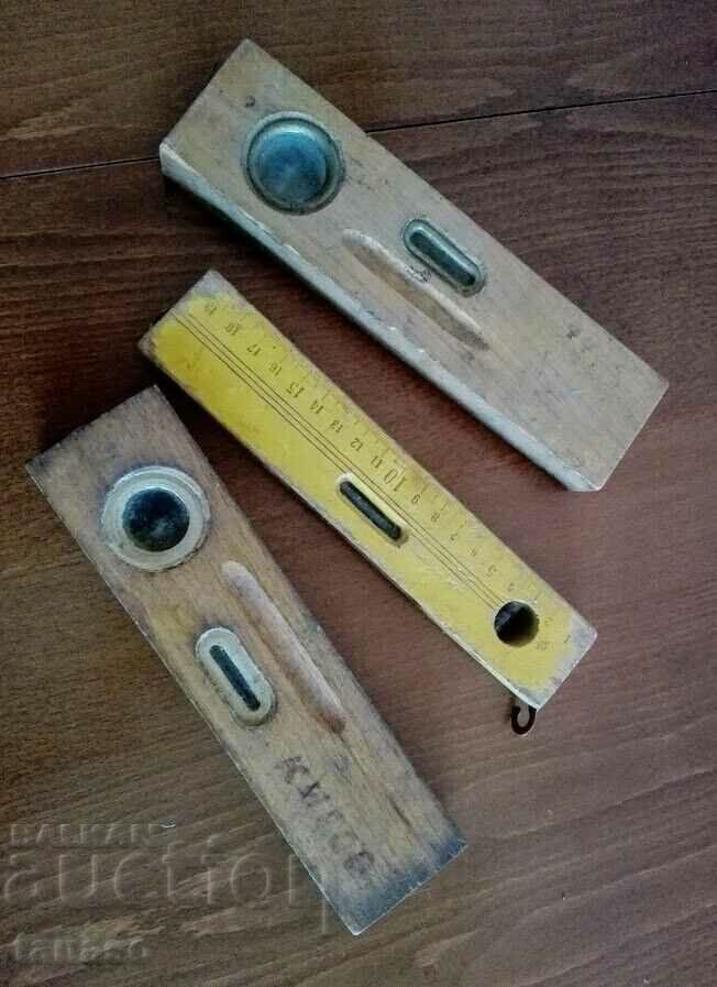 3 old wooden levels