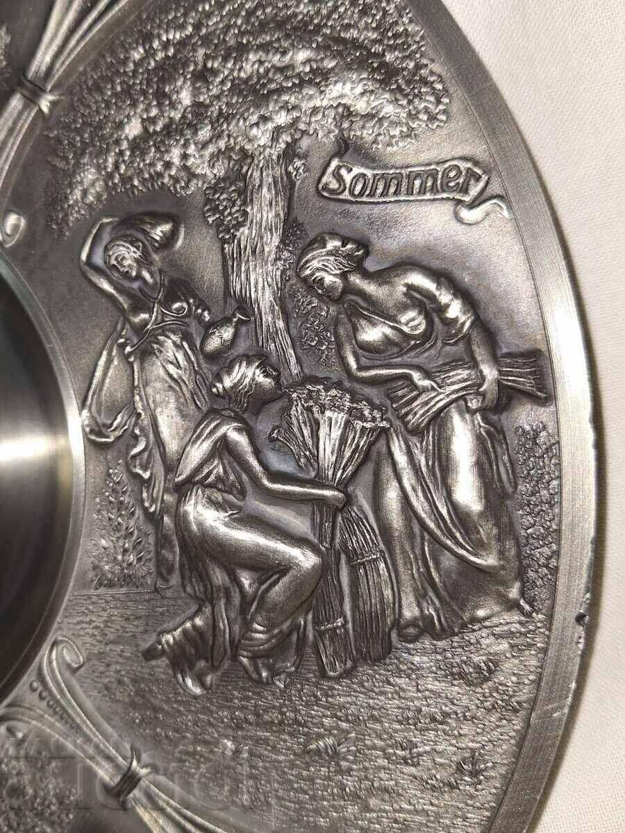 Delivery of Old pewter plate wall decoration--the four seasons Delivery of Old pewter plate wall decoration--the four seasons