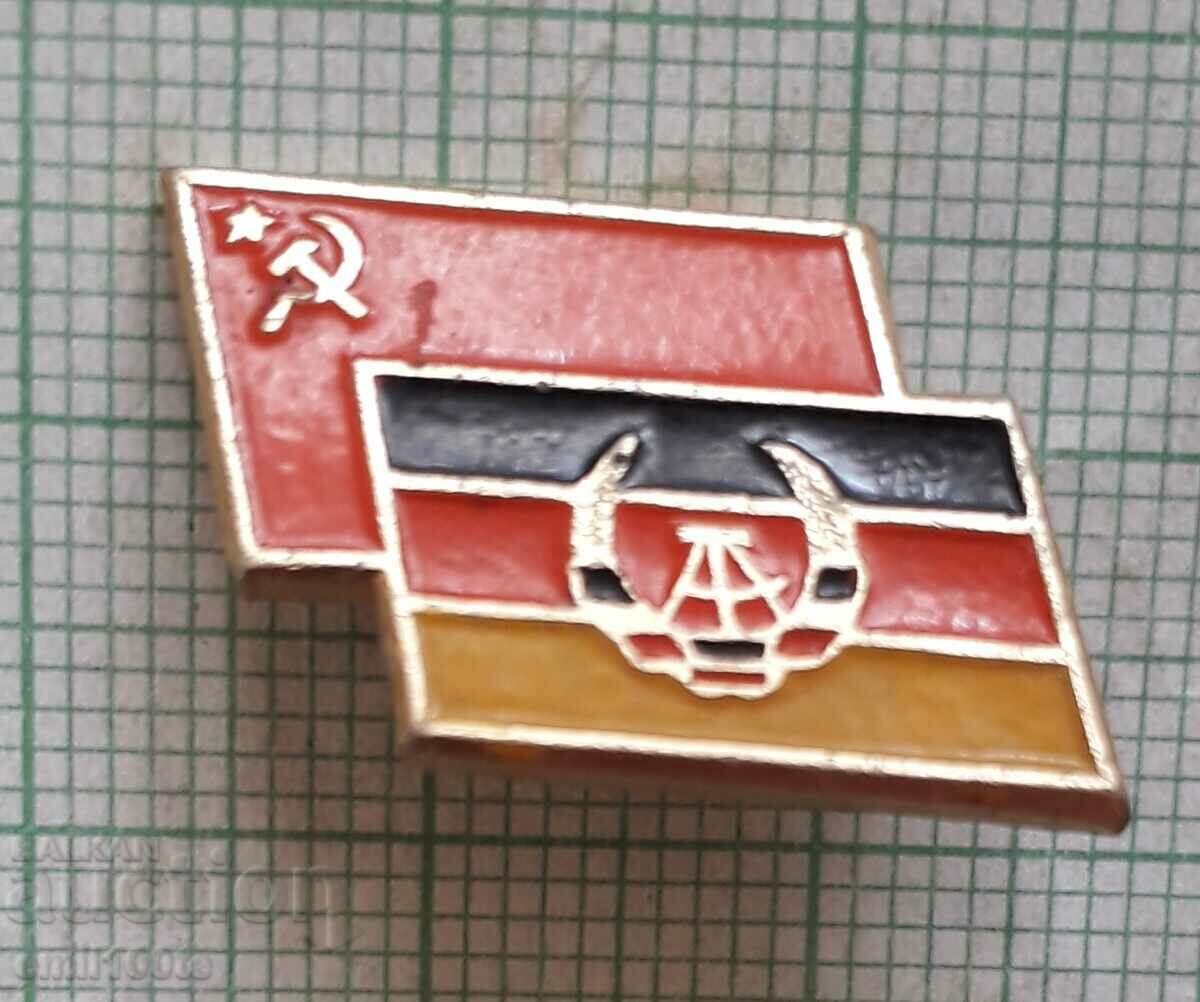 Badge - The flags of the USSR and the GDR