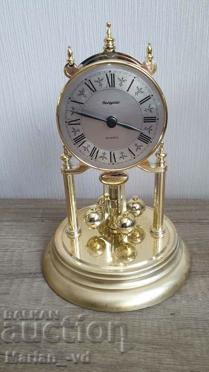 Auction Hangarter German quartz table clock with glass dome Auction Hangarter German quartz table clock with glass dome