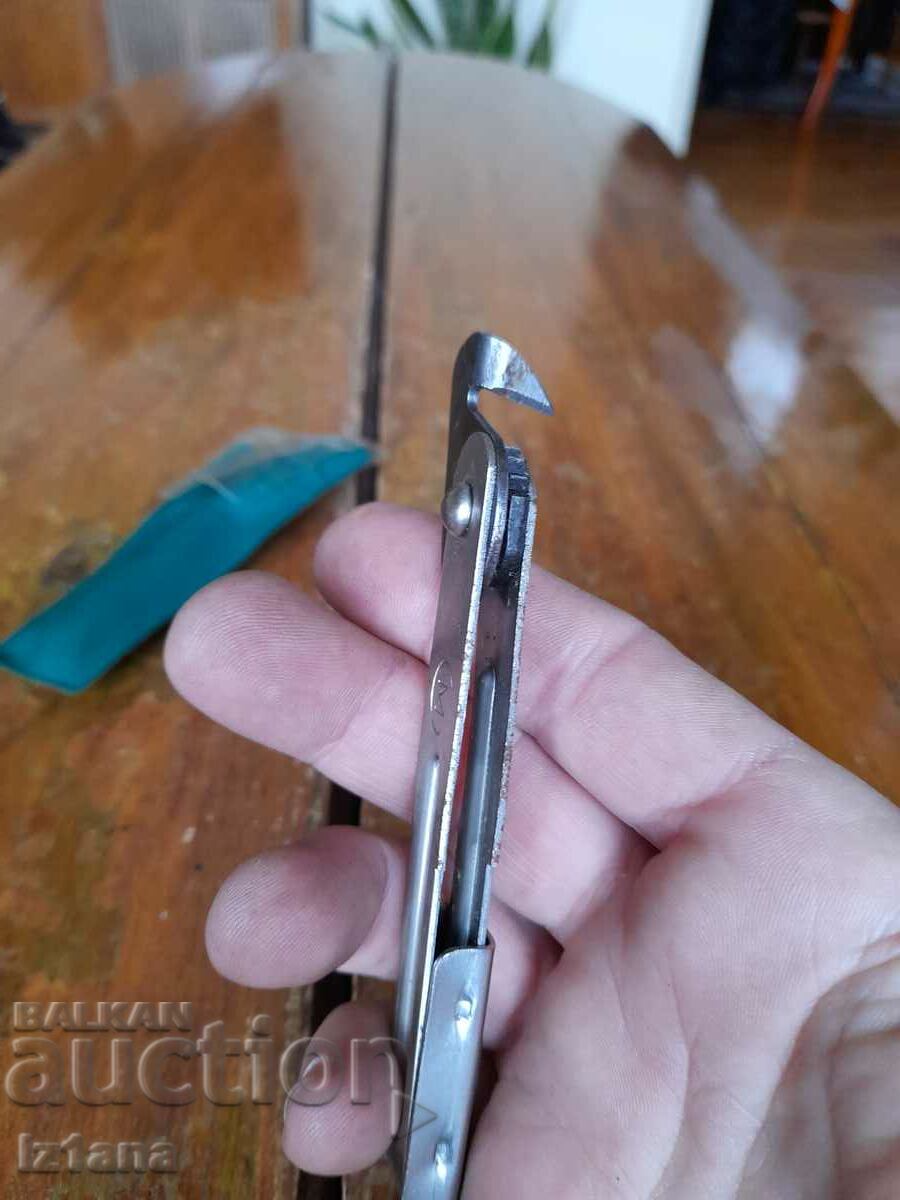 Auction  Old can and bottle opener