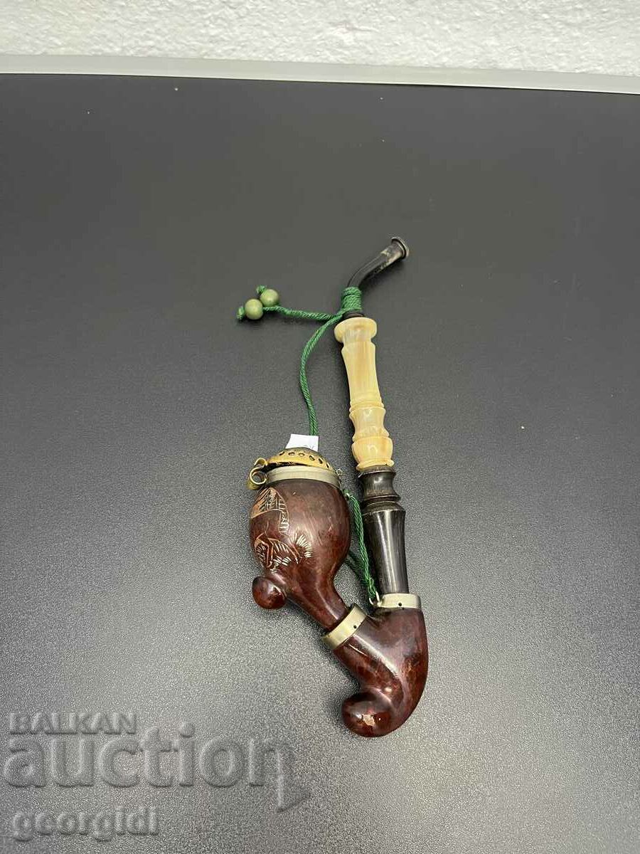 A collector's pipe with a horn mouthpiece. #4913