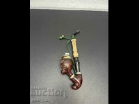A collector's pipe with a horn mouthpiece. #4913