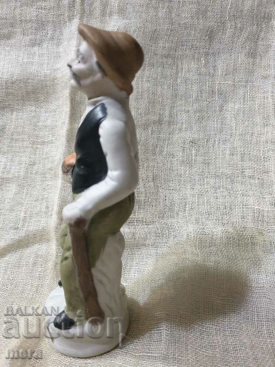 Auction  Porcelain figurine of an old man