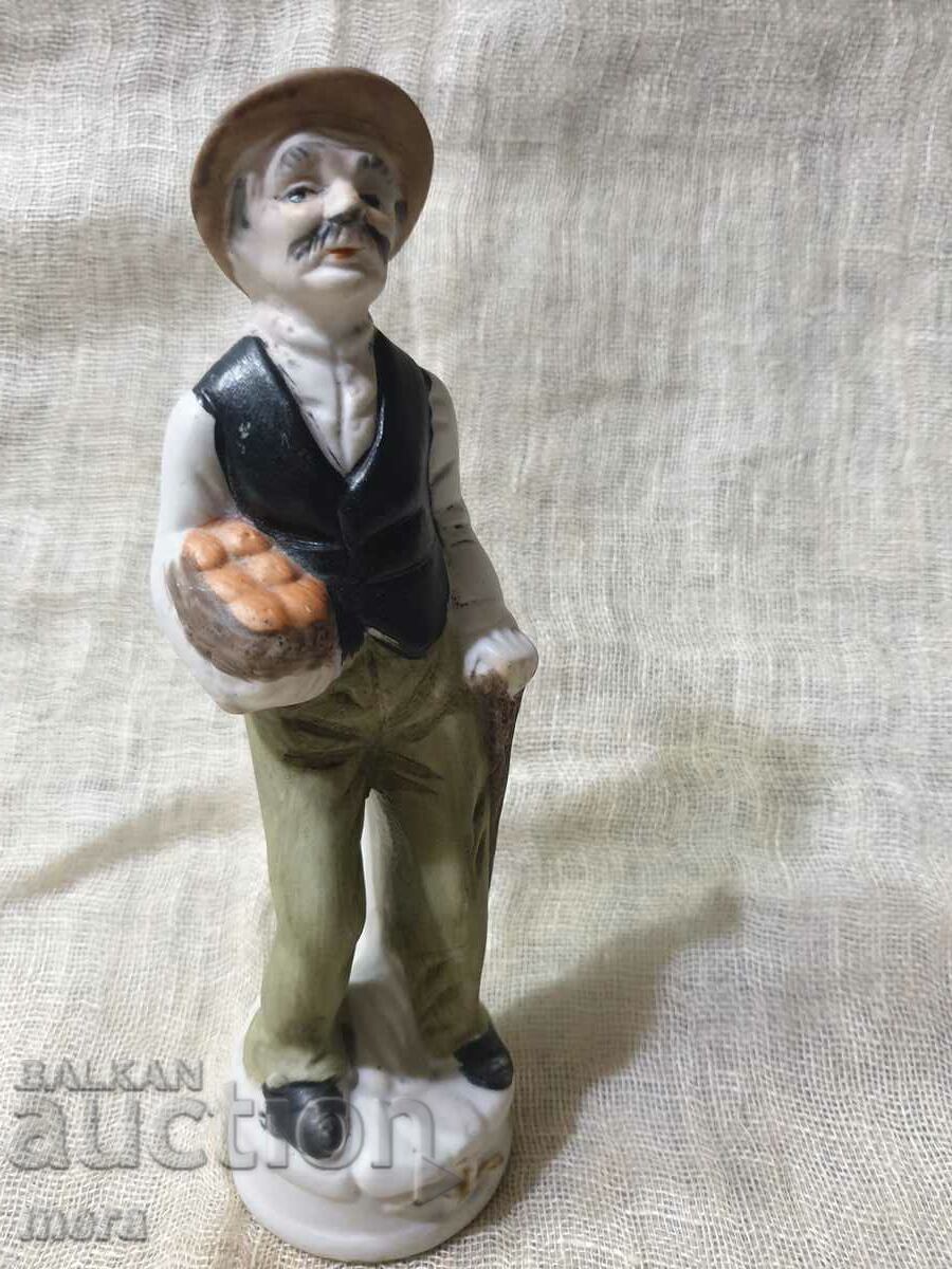 Porcelain figurine of an old man