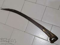 Old hand-forged wrought iron mowing scythe