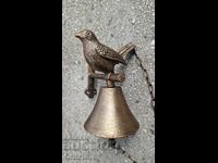 Cast iron bell with a chicken.